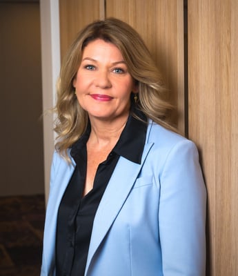 A woman in a blue blazer.