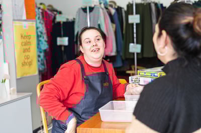 Sarah-enjoys-working-in-the-op-shop-warehouse-2